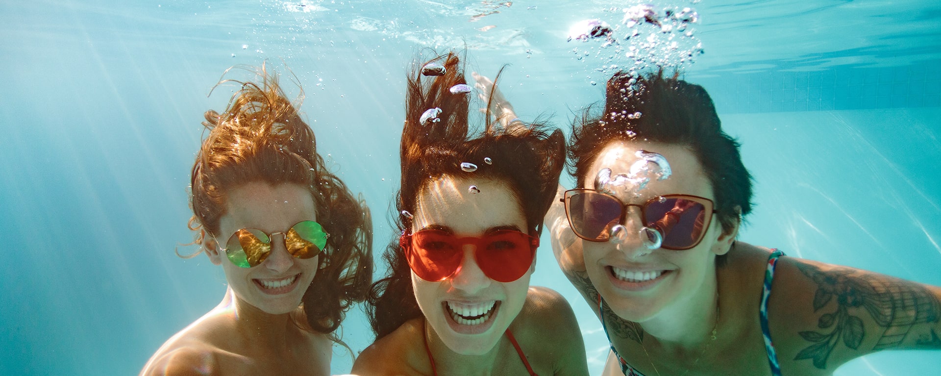 woman under the water in a pool