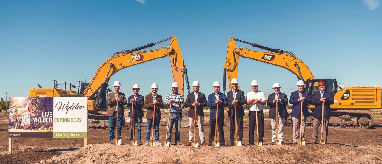 greenpointe developers group in front of construction machinery