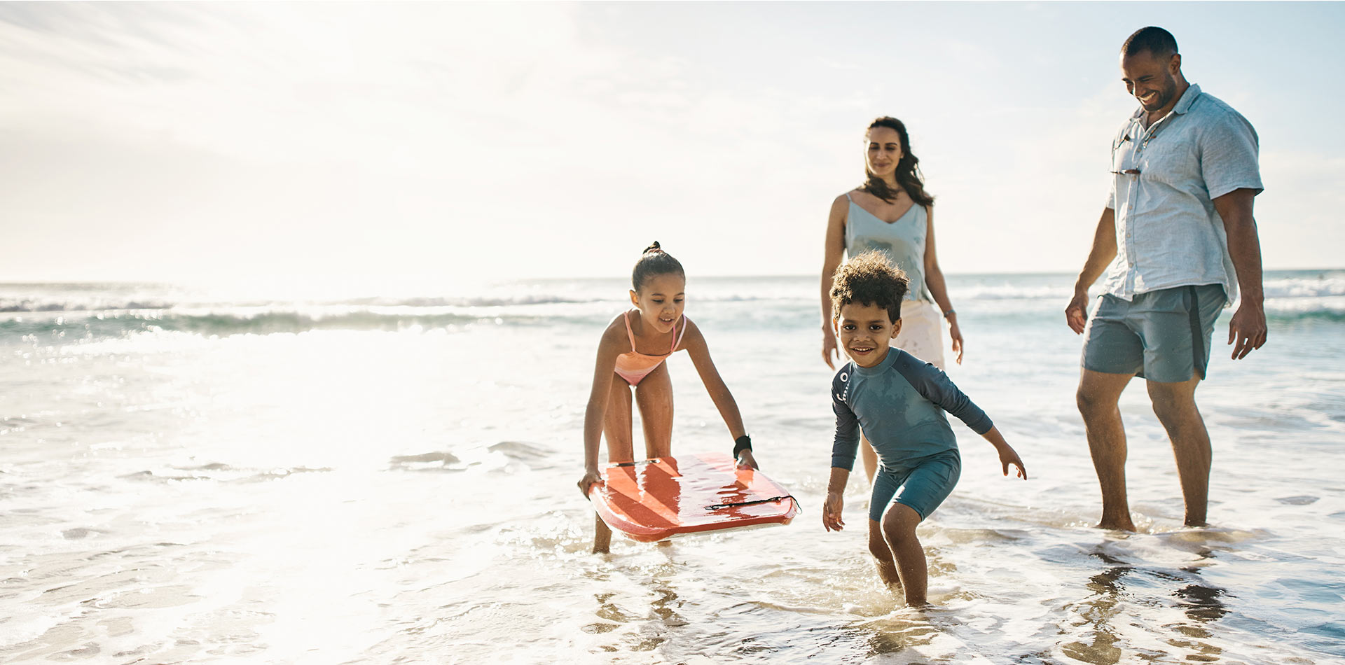 Family playing on the beach