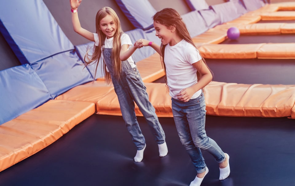 two grils having fun at Indoor Trampoline Park in St Lucie County
