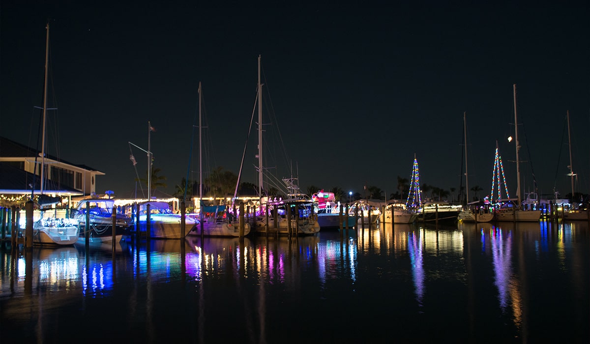 Boats decorated with lights for the St. Lucie County Holiday Boat Parade Treasure Coast Holiday Events
