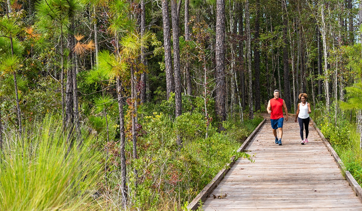 couple walking outdoors at port st lucie park