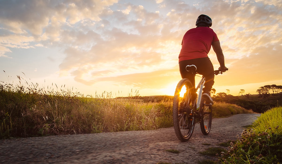 man biking at sunset outdoors in port st lucie