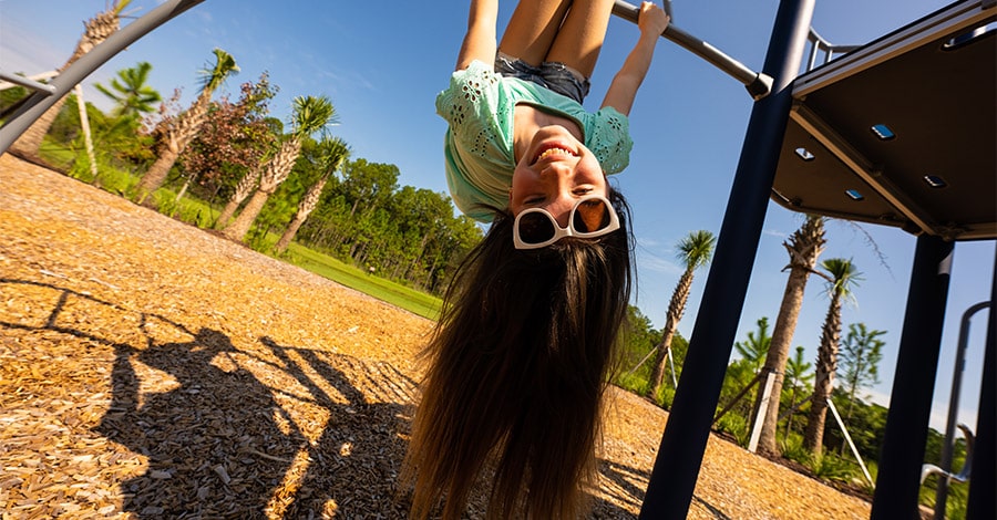 girl playing on play ground in St. Lucie County
