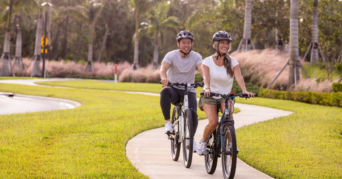 Couple Biking Through the Wylder Community