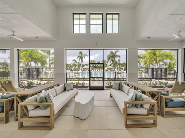 Elegant residents’ lounge overlooking the resort-style pool at Wylder Port St. Lucie