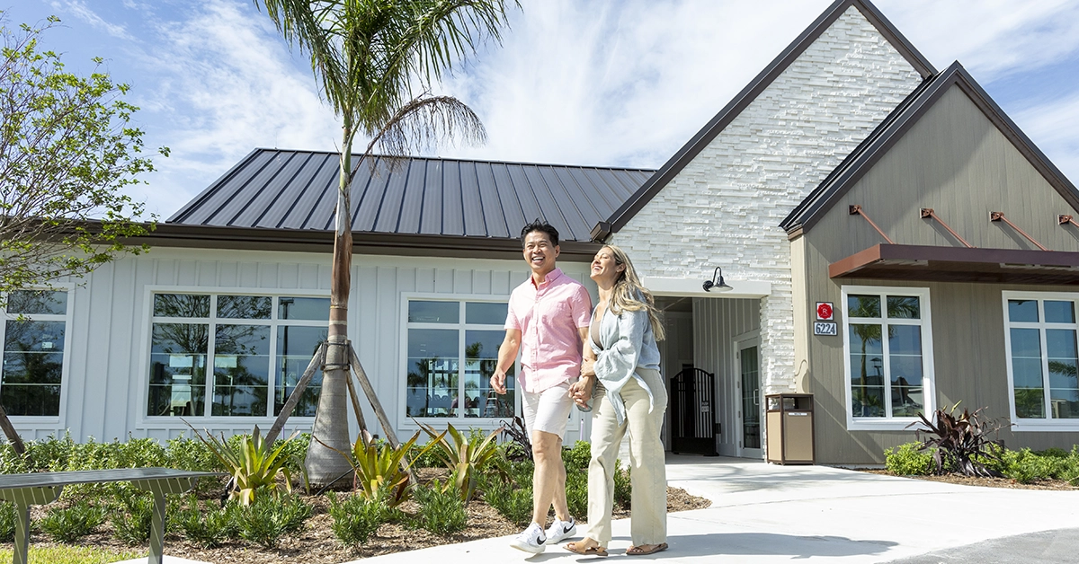 Couple walking near Brystol amenity center at Wylder community