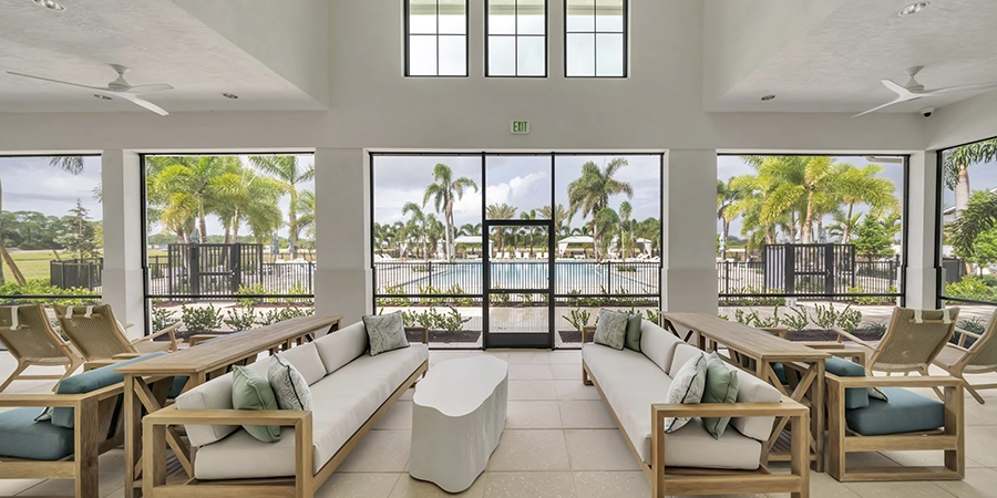 Clubhouse lounge with pool view.