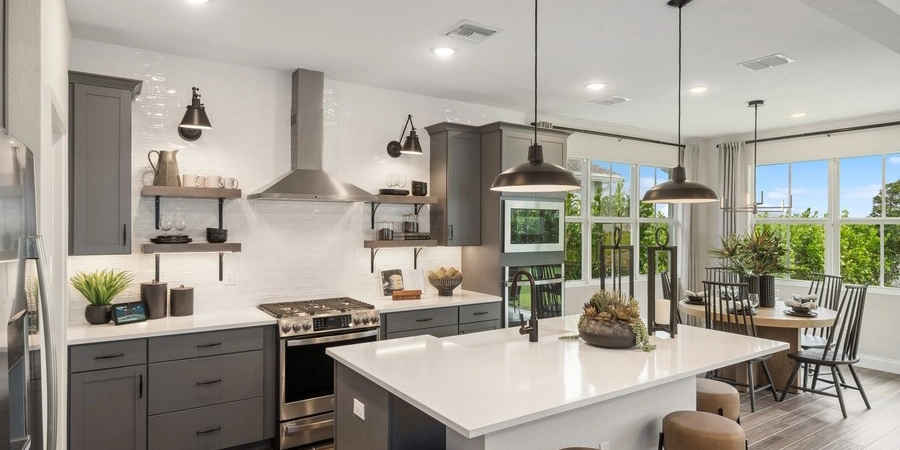 Modern kitchen interior with dining area.