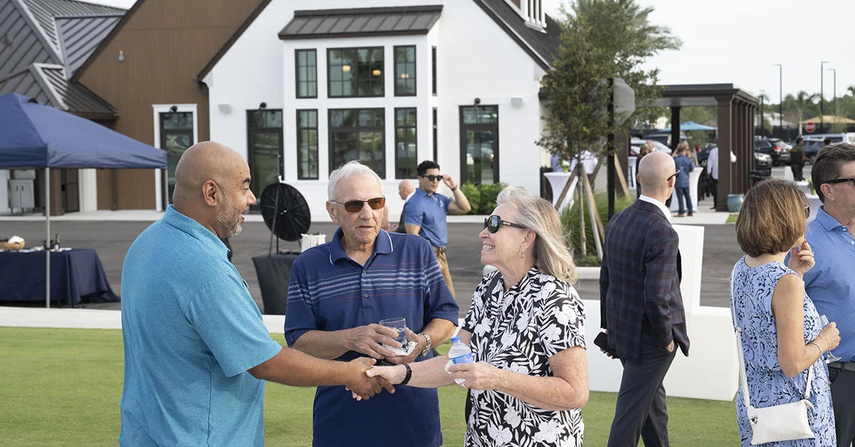 Residents socializing at outdoor community event