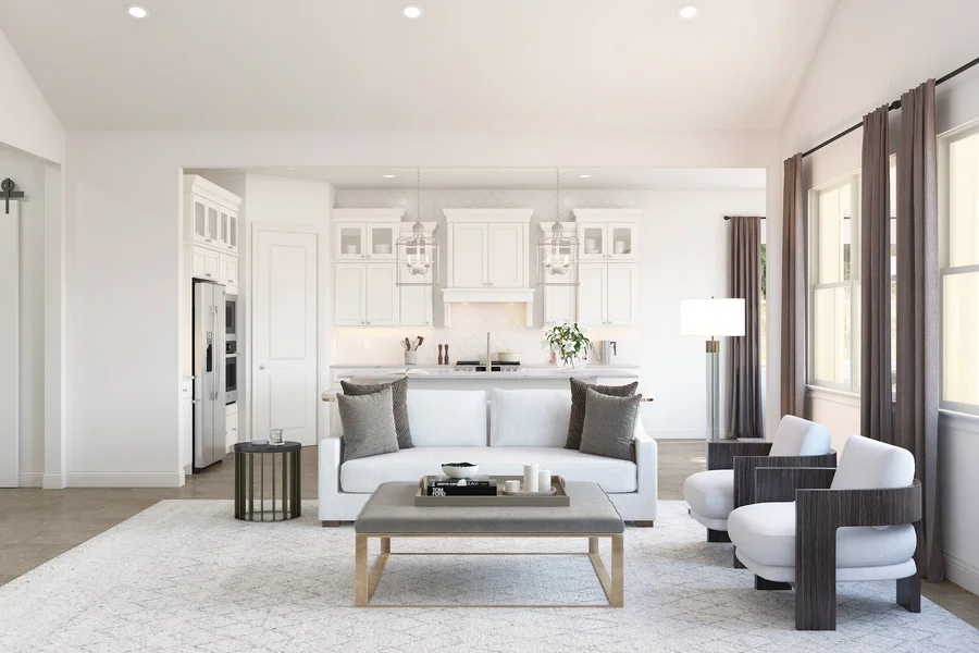 Rendering of a great room with a white sofa, gray accent pillows, and an open kitchen, shown in a restoration classic design palette.