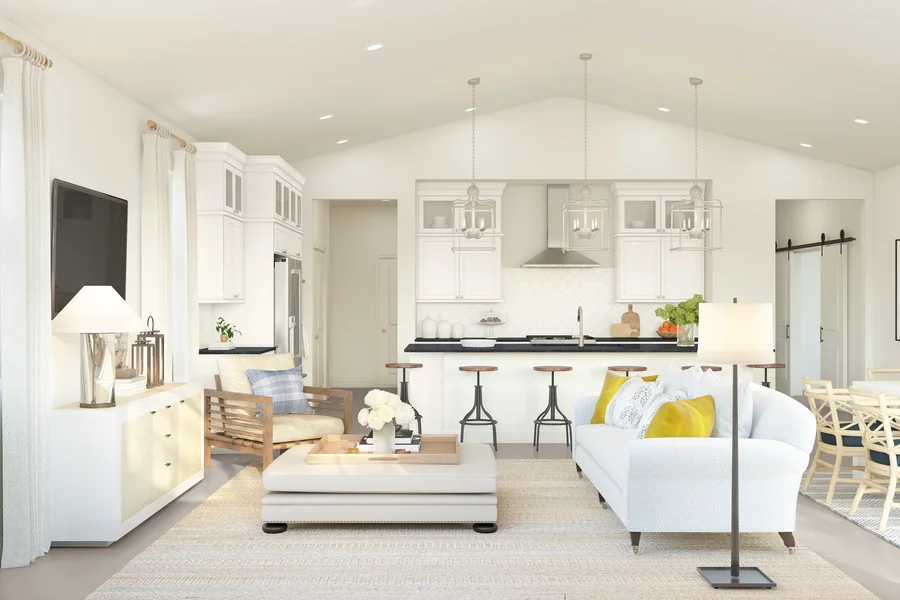 Rendering of a great room with wood ceiling beams, a cream sectional sofa, and an open kitchen, shown in a coastal classic design palette.